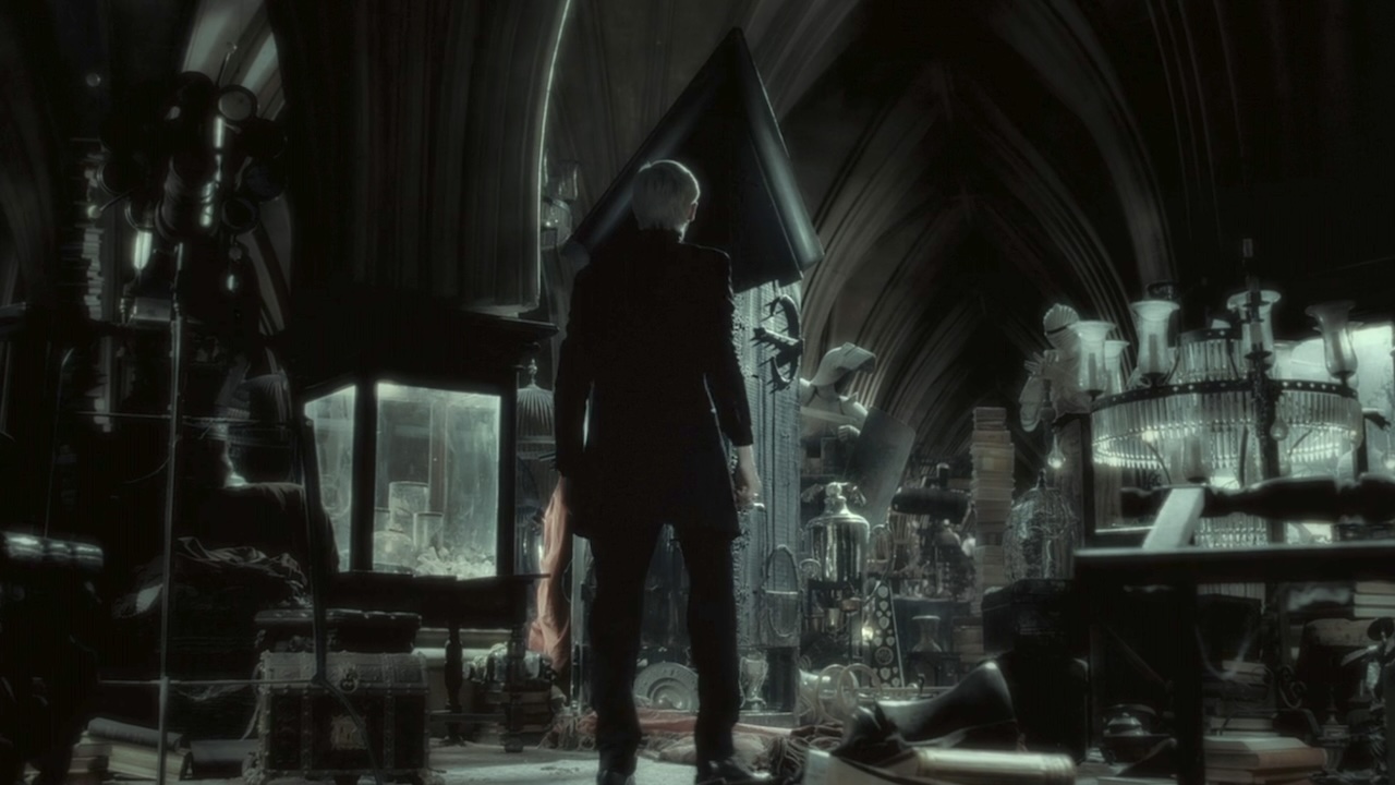 Draco standing in front. of the vanishing cabinet