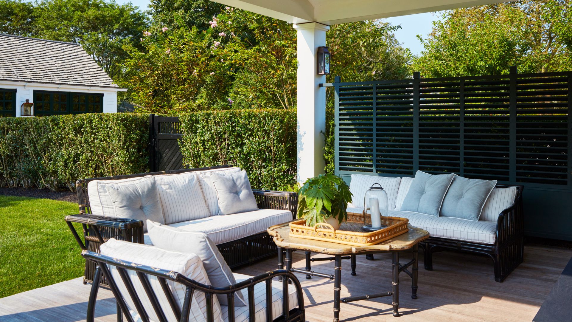 Bryan Graybill&#039;s veranda with outdoor seating and table set with a tray
