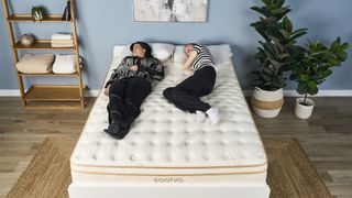 One of our testers sleeps on her side on the Saatva Classic Mattress while the other sleeps on her back to see how the mattress compares in terms of comfort for these sleeping positions