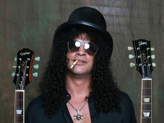 Slash with his new Epiphone and Gibson Goldtop Les Pauls