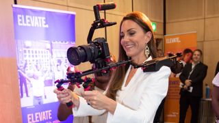 Catherine, Princess of Wales holds a video camera while speaking to people from the ELEVATE initiative