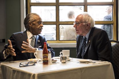 Bernie Sanders chats with the Rev. Al Sharpton.