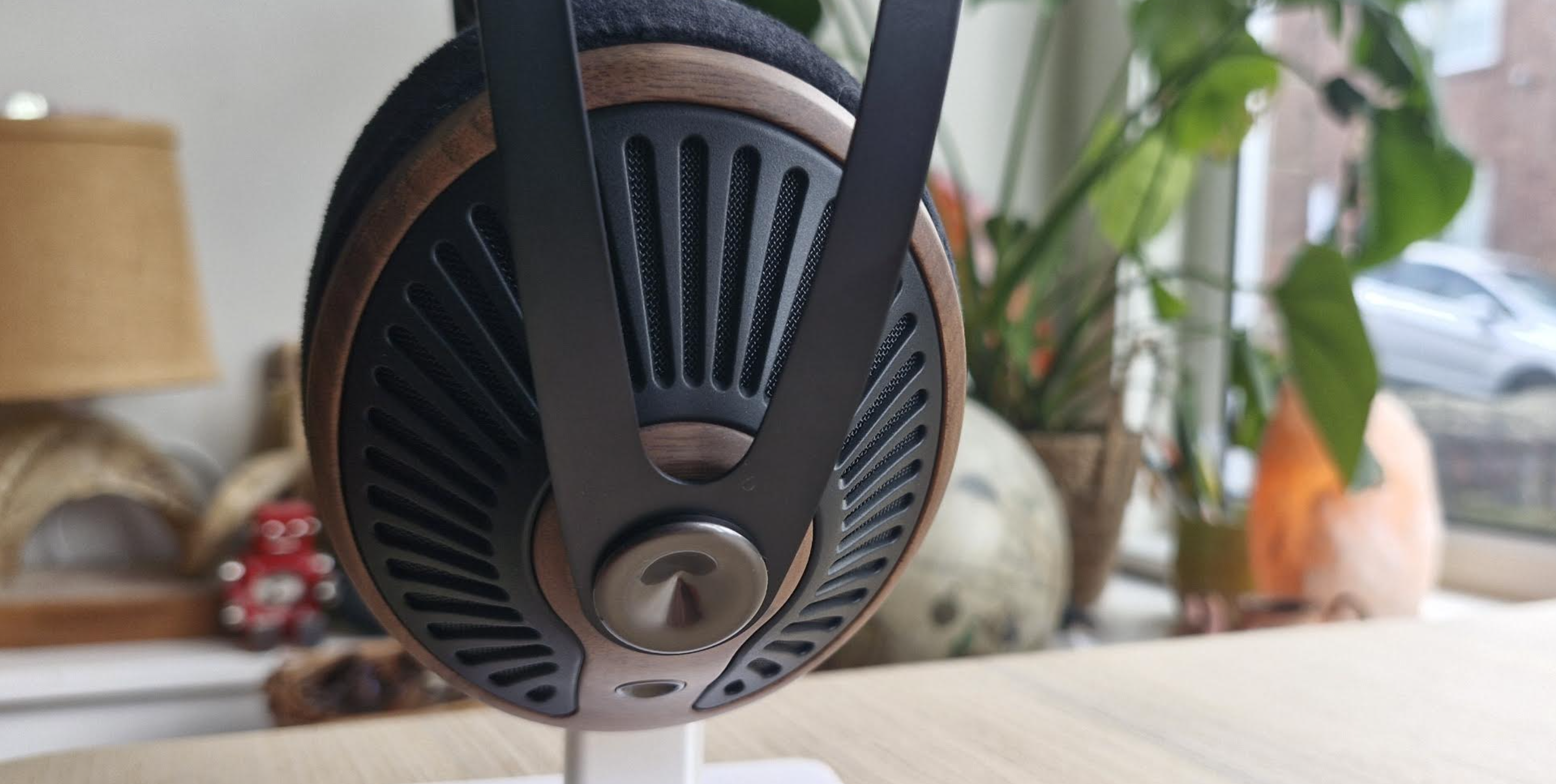 Meze Audio 105 Silva headphones on a light wooden table