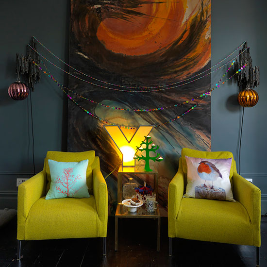 living room with cushion on armchair and decoration with picture on wall