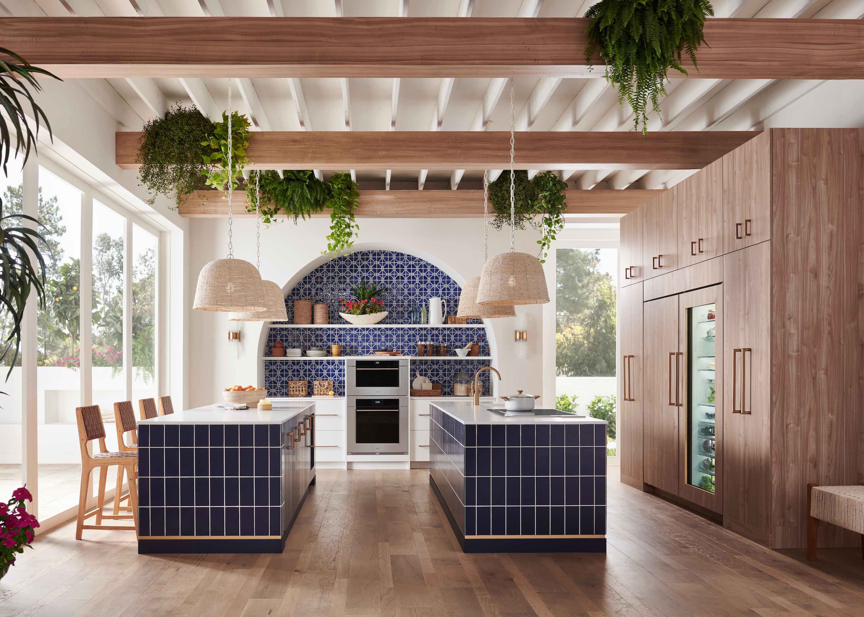 kitchen with two blue tiled islands