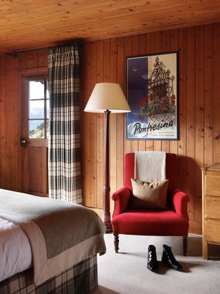 a wood bedroom inside a chalet