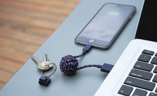 Native Union’s nautical range cable is connected to the iPhone and MacBook laptop.