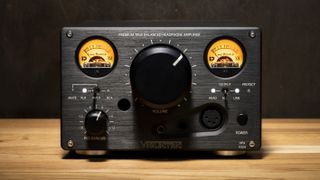 Violectric HPA V324 headphone amplifier in black on a wooden counter