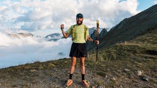 Ultra runner Jake Catterall in the Alps celebrating