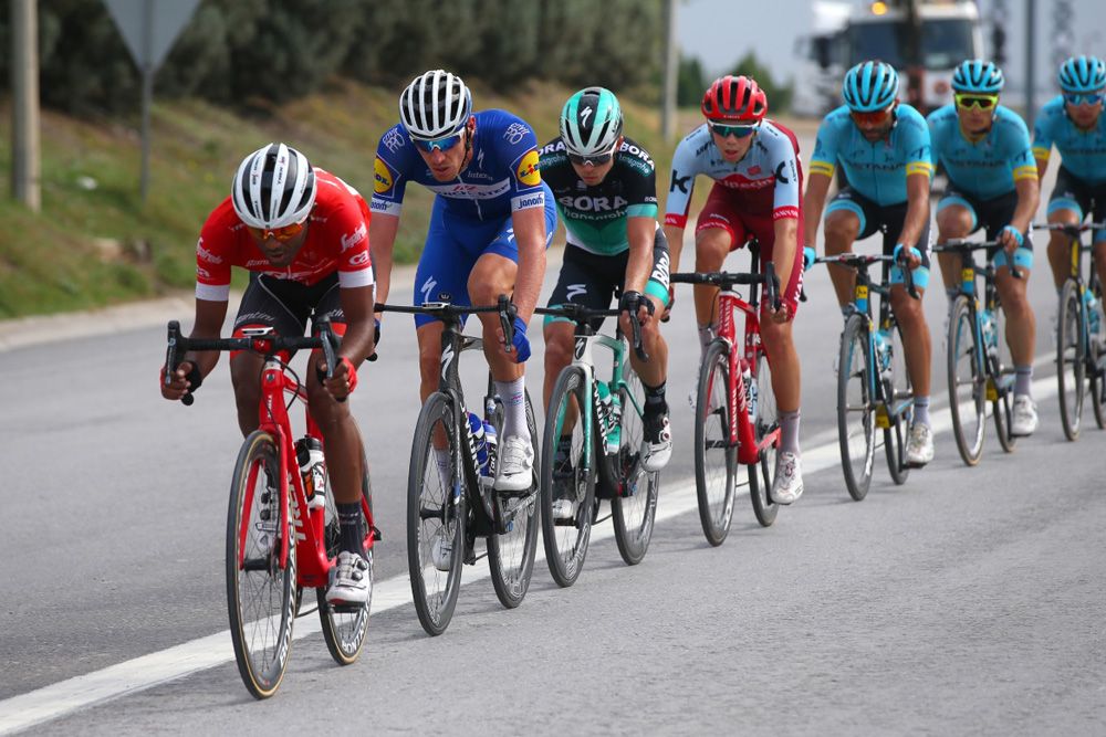 The peloton chase down the break