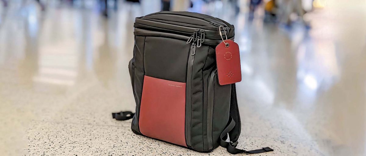 Waterfield Air Porter Travel Backpack on airport hard floor. 