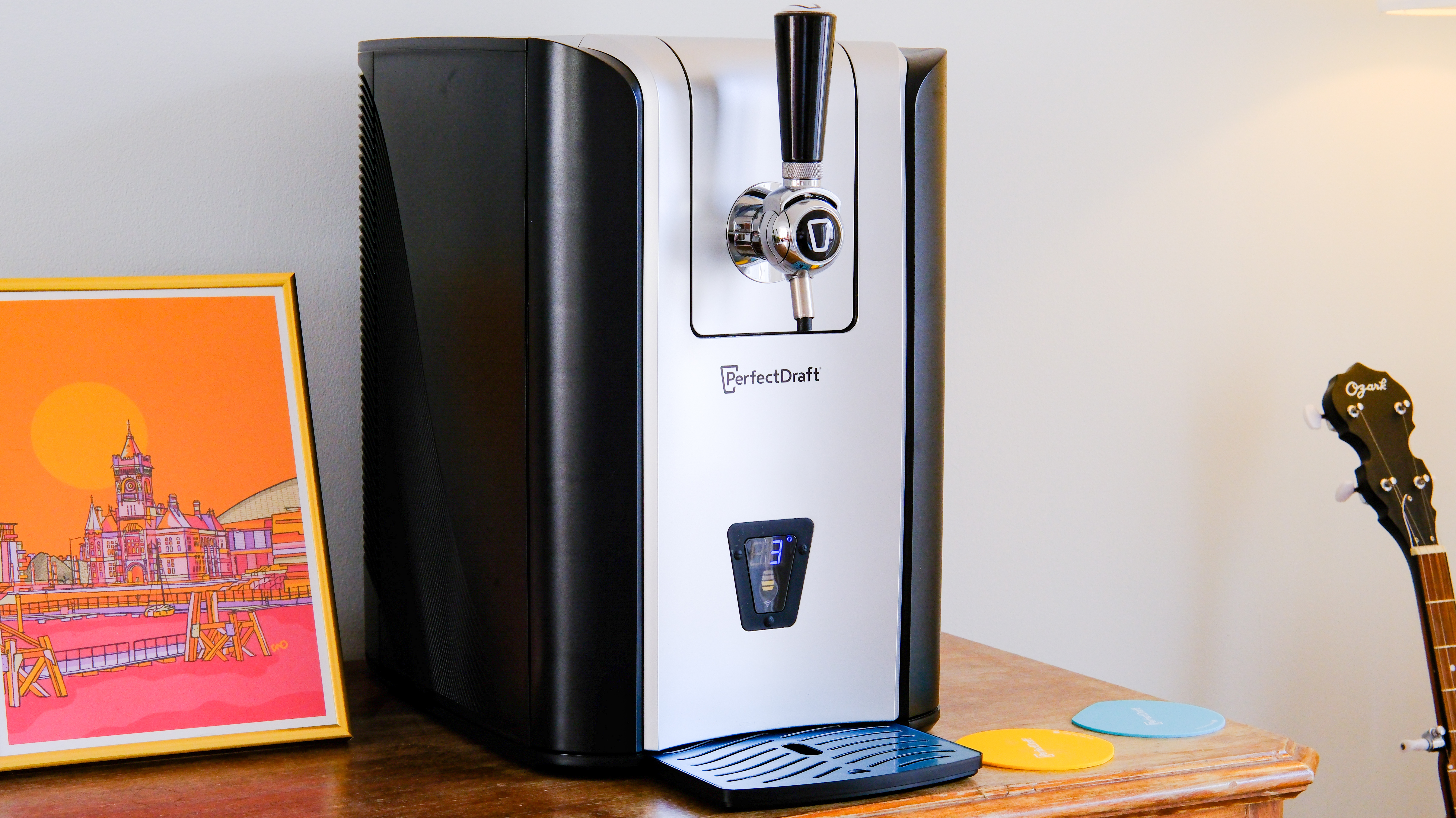 The PerfectDraft Beer machine on a side table