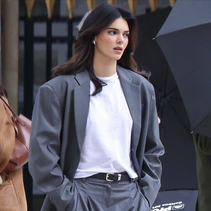 Kendall Jenner looks stunning as she models for a L'Or&eacute;al shoot in Paris in an oversize gray suit and white tee