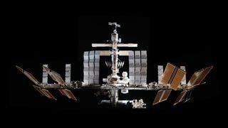 The International Space Station floating in the black void of space.