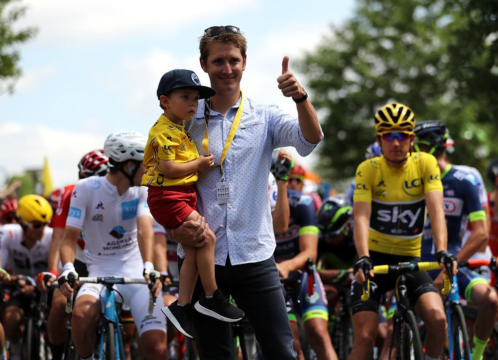 Andy Schleck at the start with his his young son