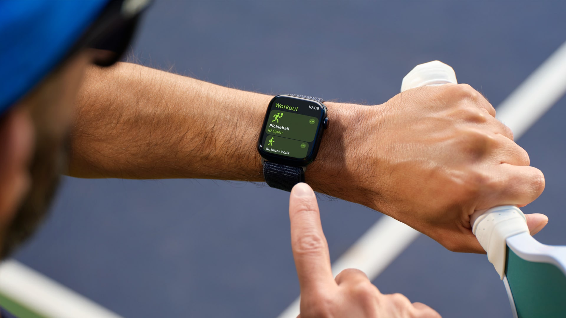 A person tracks a pickleball workout on an Apple Watch.