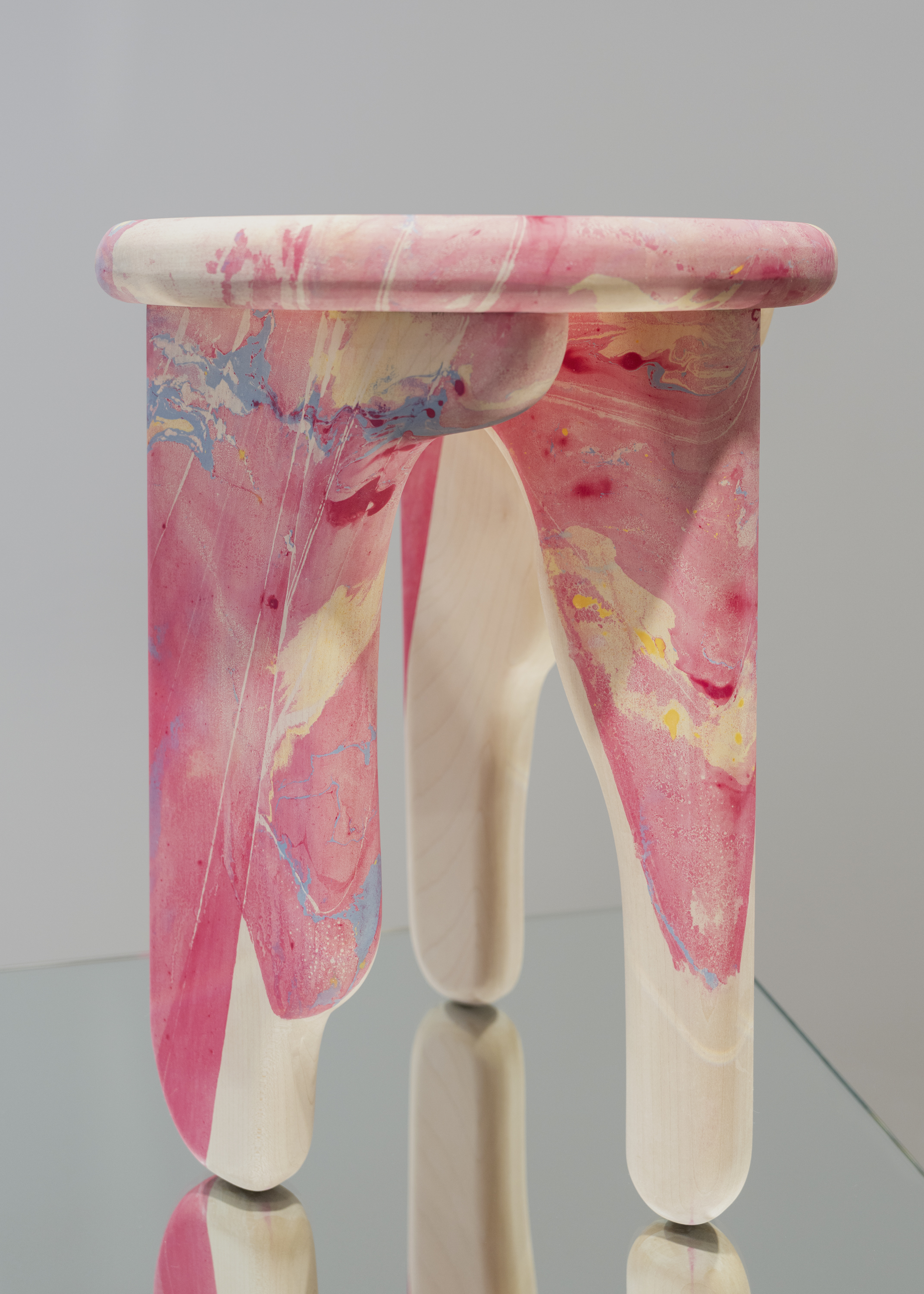wooden stool with pink marbled surface