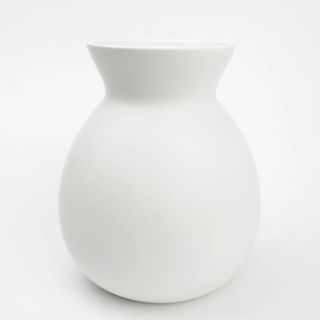 a product photo of a white ceramic vase on a plain background