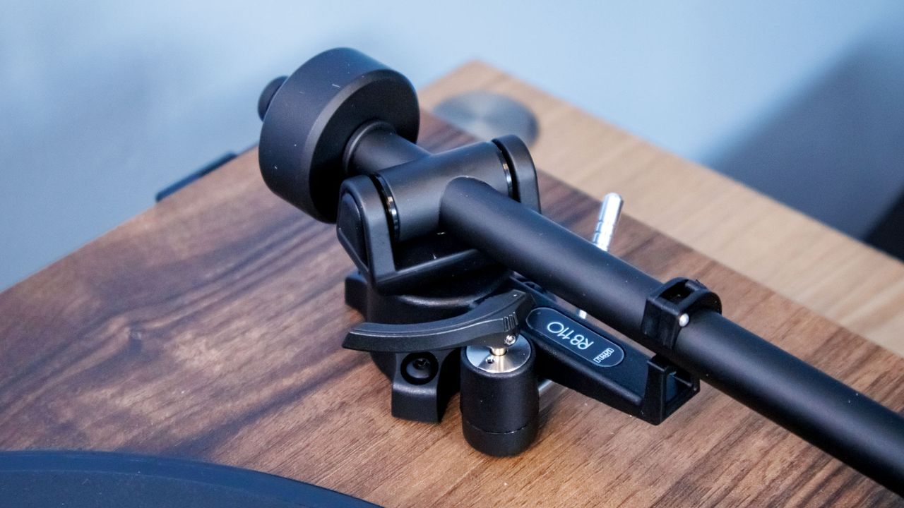 A closeup of the tonearm end of the Rega Planar 1 Plus turntable