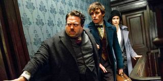 Jacob, Newt and Porpentina walk carefully down a hallway in 'Fantastic Beasts and Where To Find Them'