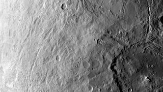 A large crater on the dwarf planet Ceres (lower right) is seen in this photo captured by NASA's Dawn spacecraft on June 6, 2015.