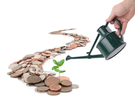 Hand using a watering can to water a sapling that is growing for a trail of coins that leads off into the distance, on a white background