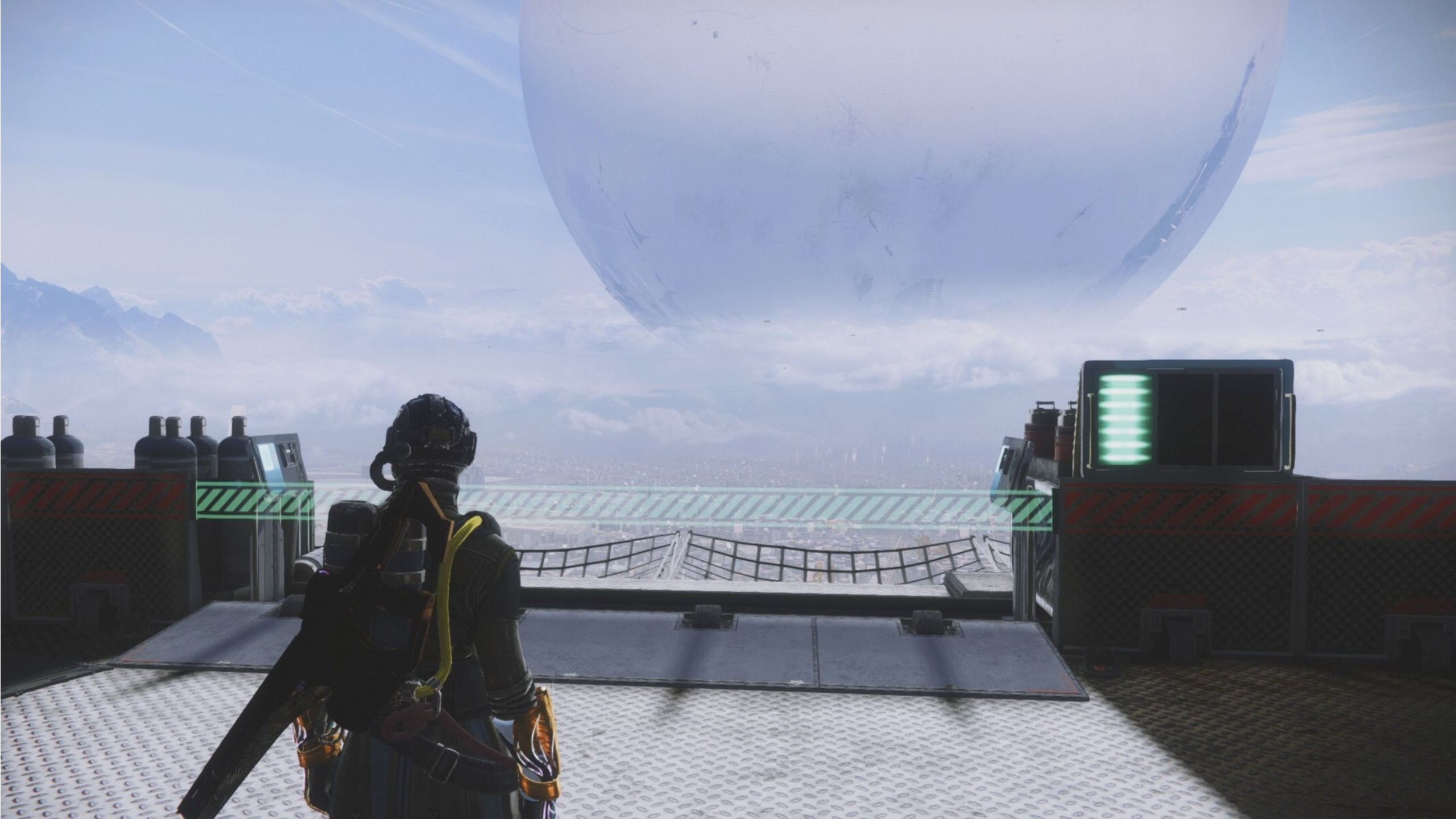 Destiny 2 hidden net: A Warlock standing next to the Tower Hangar goals overlooking the Traveler.