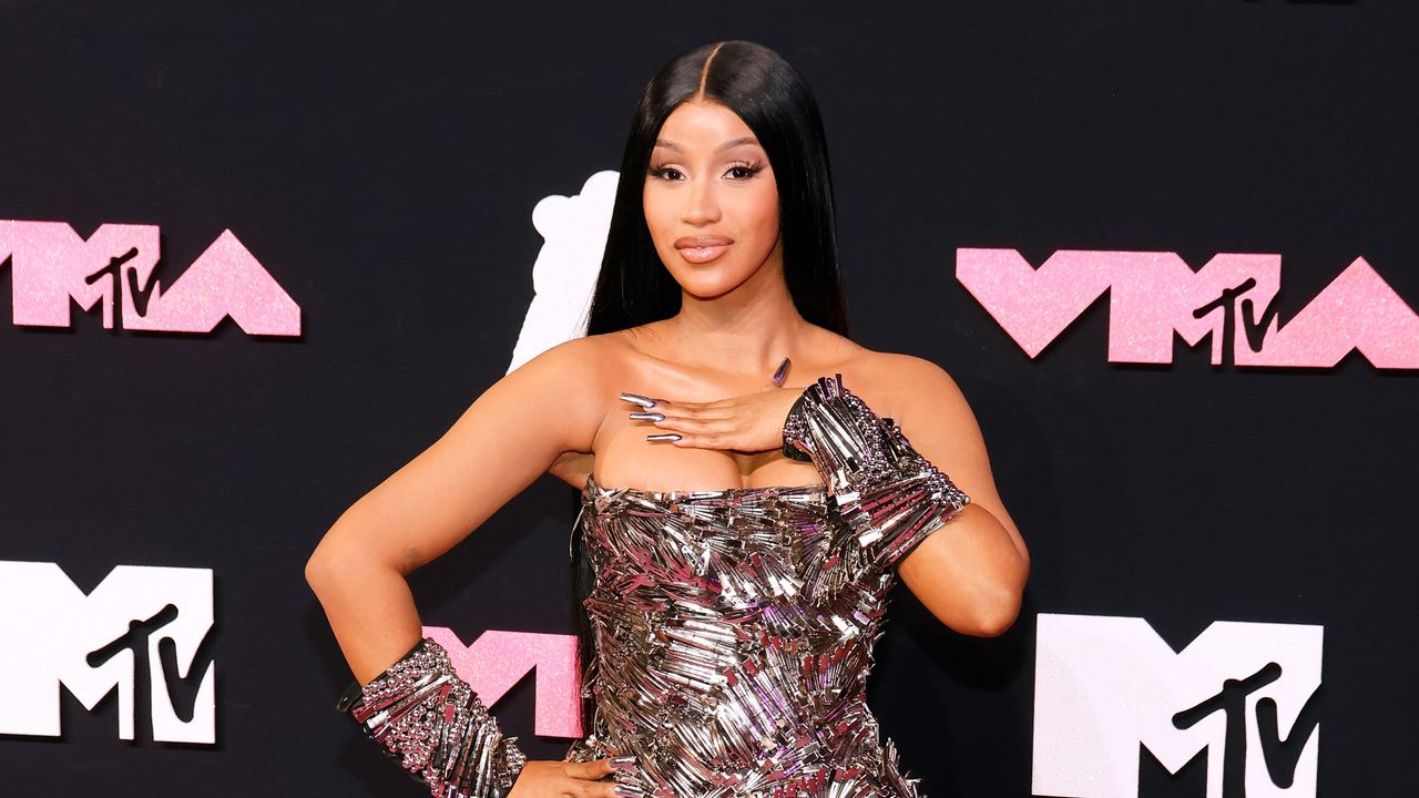 Cardi B&#039;s favorite blender has gone viral. Here she is picturesd on the red carpet in silver gown with black background