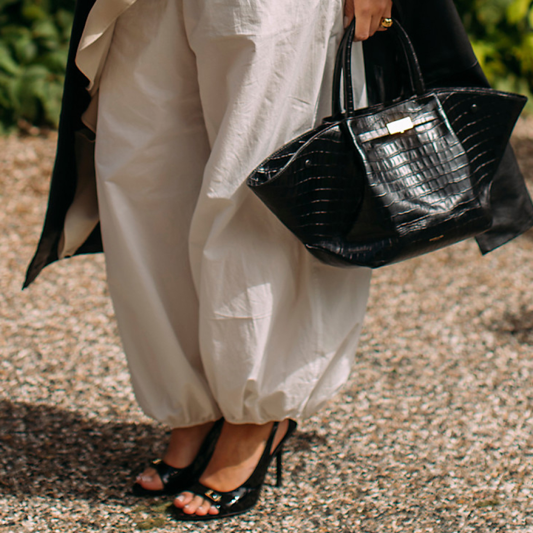 Woman wearing black peep toe heels 