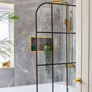 Bathroom with crittall-style shower screen and gold shower fitting