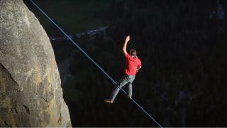 A climber walking a rope in Valley Uprising