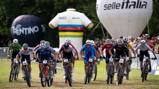 Riders racing side by side at UCI Mountain Bike World Championships 2026 in Val di Sole