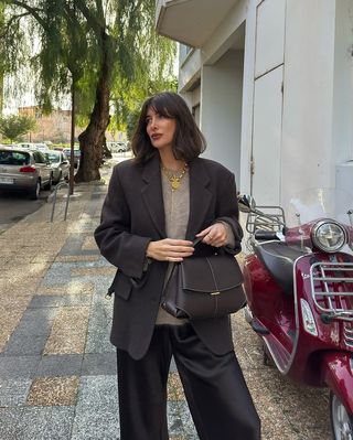 French Outfit Updates: @juliesfi wears a pair of brown satin trousers with a brown blazer