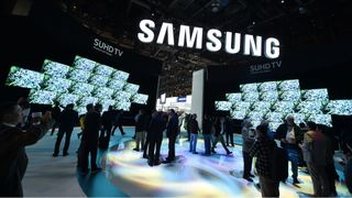 A view of a Samsung product show with TVs on display