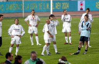 Real Madrid players look dejected after defeat to Real Zaragoza in the 2004 Copa del Rey final.