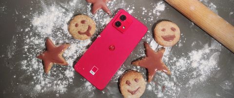 The Moto G84 looking festive amongst some baked goods