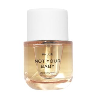 A press shot of the glass bottle of Phlur Not Your Baby Eau De Parfum