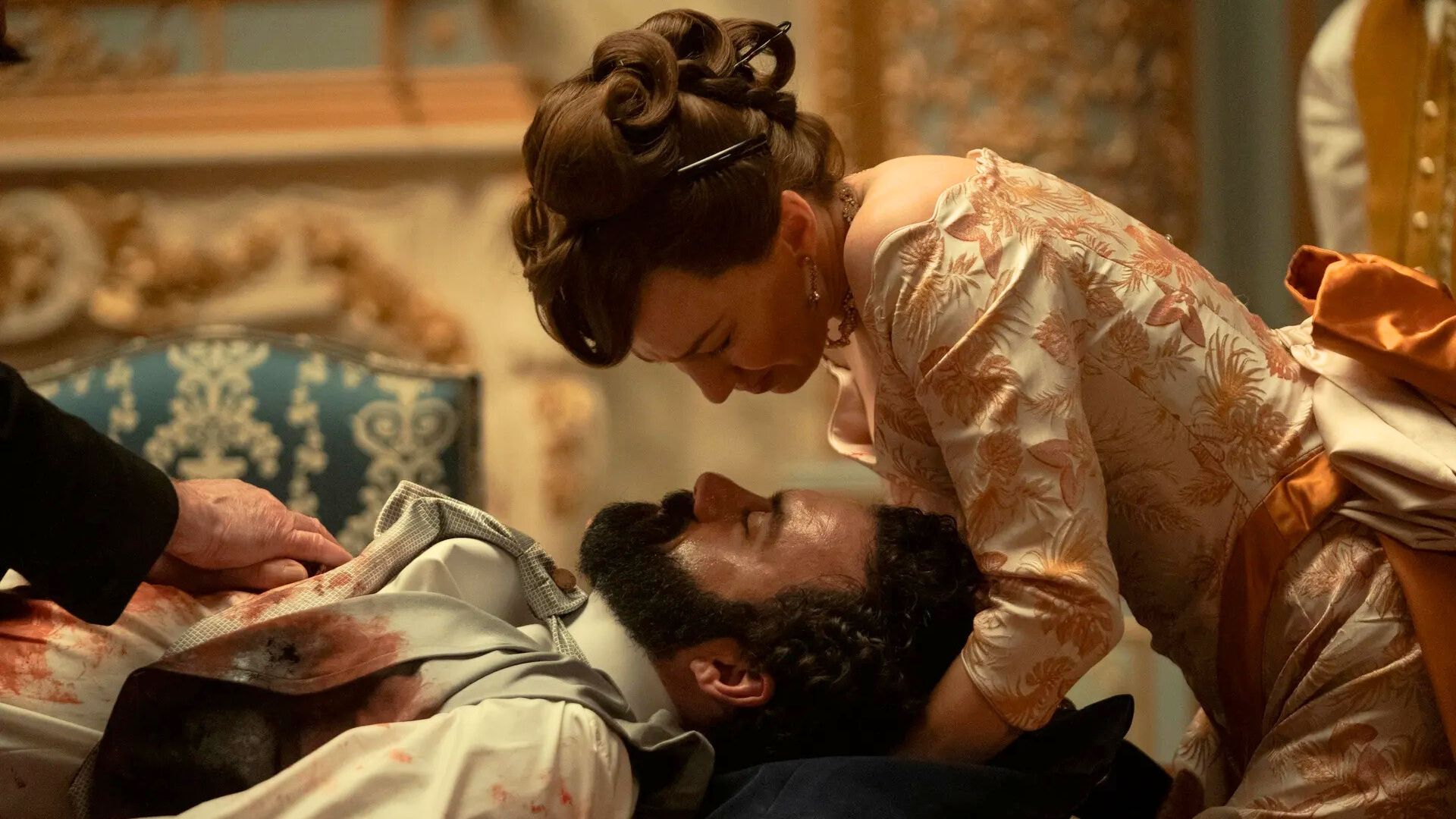 Bertha holds George's head as he bleeds out