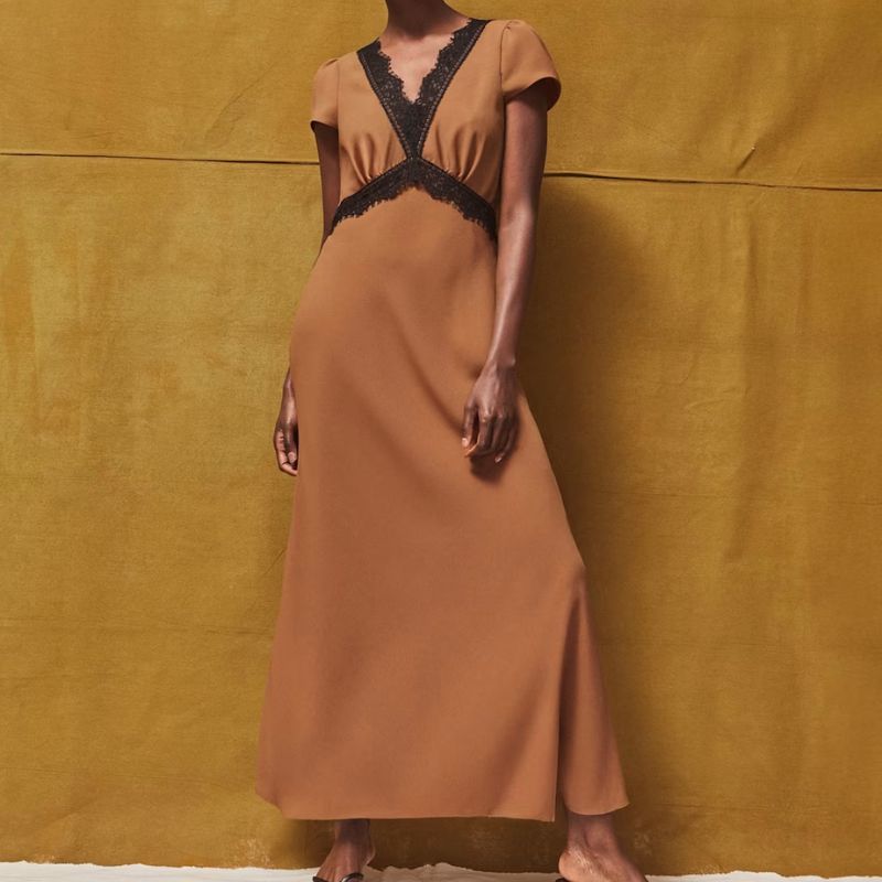 tan dress with black lace trim