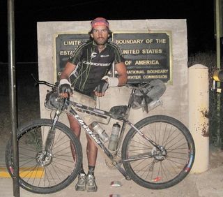 Matthew Lee (Cannondale Factory Racing) poses for the finish shot after wining the 2010 Tour Divide in Antelope Wells.