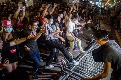 Hong Kong pro-democracy protesters retake demonstration site from police