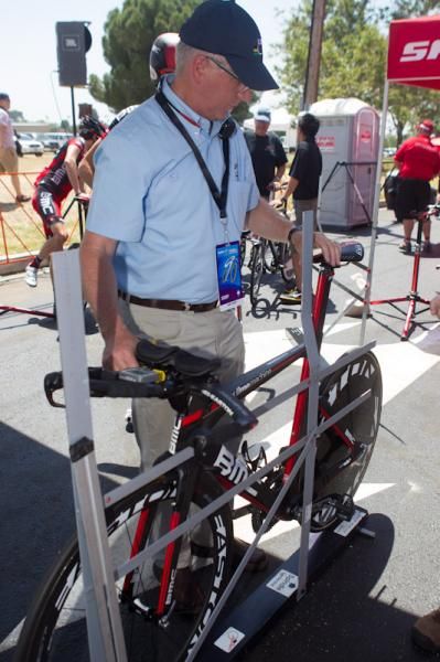 A bike gets checked over by an official.