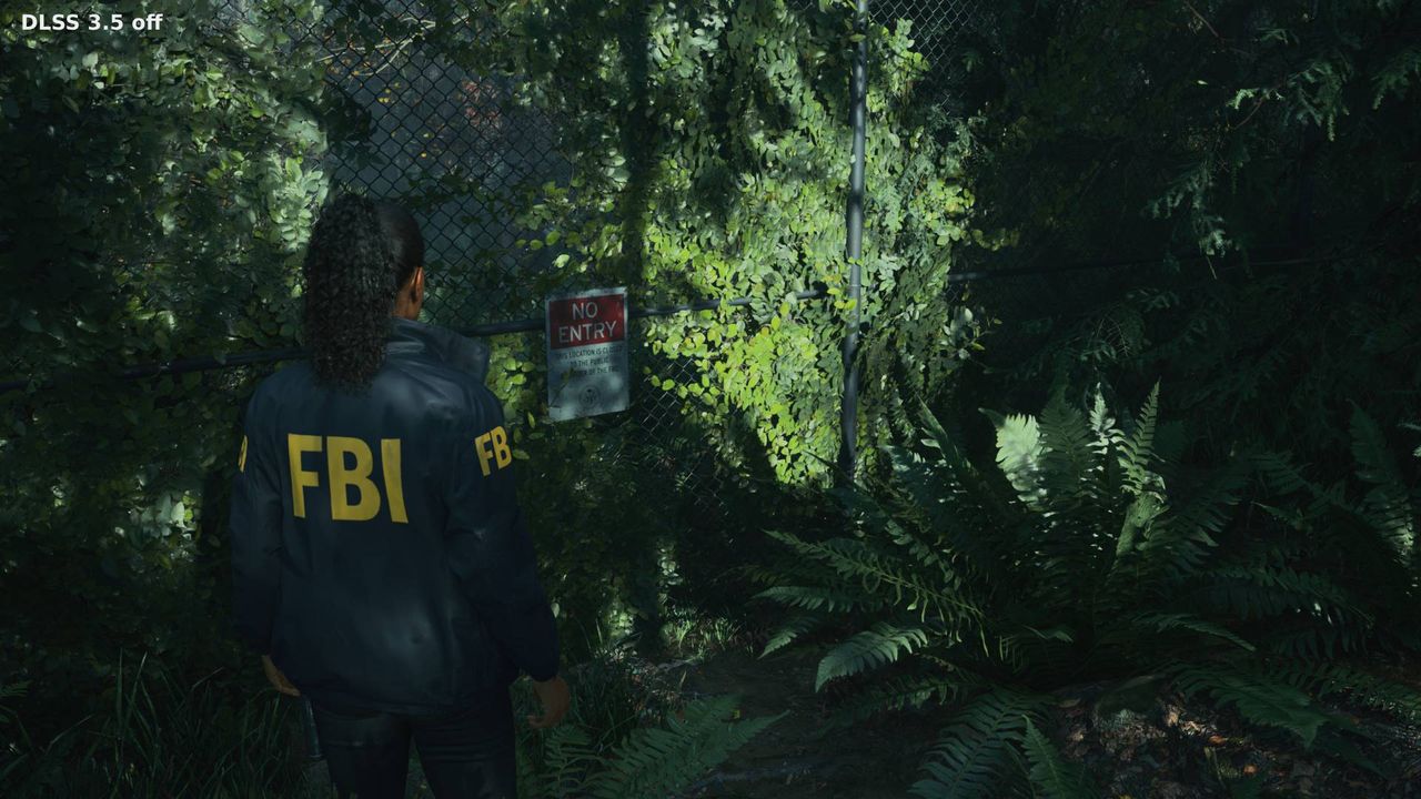 Alan Wake 2 screenshot with Ray Reconstruction off next to fence