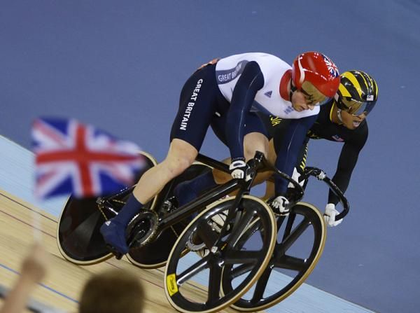 Jason Kenny (Great Britain) comes around Azizulhasni Awang (Malaysia) in a heat of the men's sprint 1/4 finals.