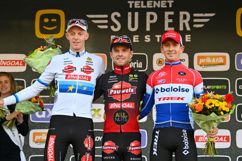 OVERIJSE BELGIUM OCTOBER 22 LR Michael Vanthourenhout of Belgium and Team Pauwels Sauzen Bingoal on second place race winner Eli Iserbyt of Belgium and Team Pauwels Sauzen Bingoal and Lars van der Haar of The Netherlands and Team BaloiseTrek Lions on third place pose on the podium ceremony after the 63rd UCI Cyclocross World Cup Druivencross Overijse 2023 Mens Elite on October 22 2023 in Overijse Belgium Photo by Luc ClaessenGetty Images