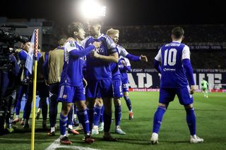 Dinamo Zagreb players celebrate a goal against Real Betis in February 2024.