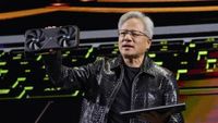 Jensen Huang, co-founder and chief executive officer of Nvidia Corp., speaks while holding one of the company's new GeForce RTX 50 series graphics cards during the 2025 CES event in Las Vegas, Nevada