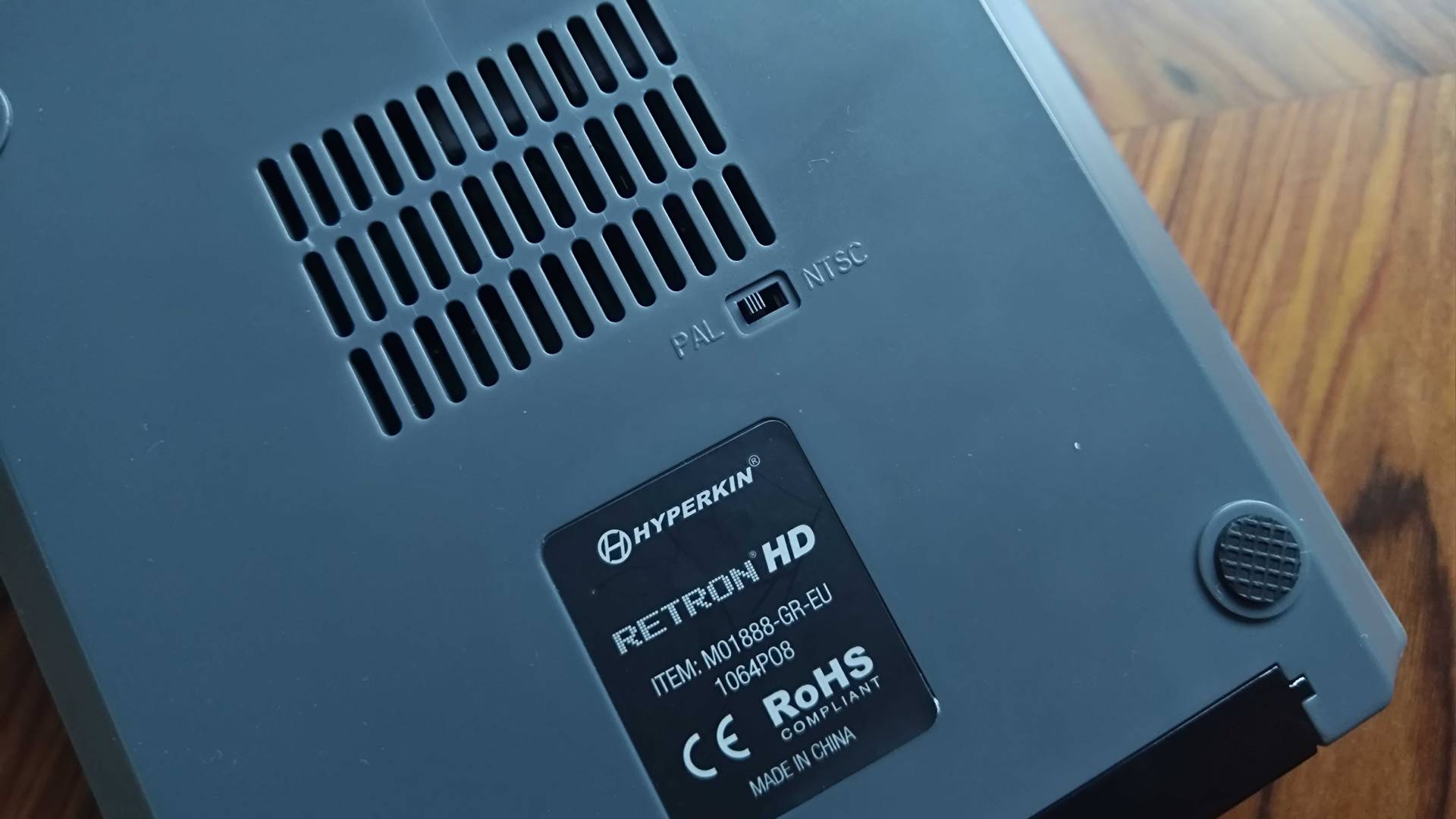 Bottom of Hyperkin Retron HD with PAL and NTSC region switch in view.