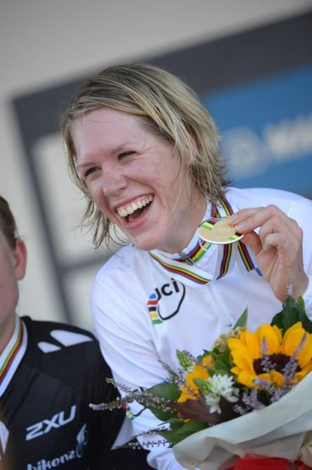 A beaming Ellen Van Dijk shows off her gold medal from the individual time trial world championship