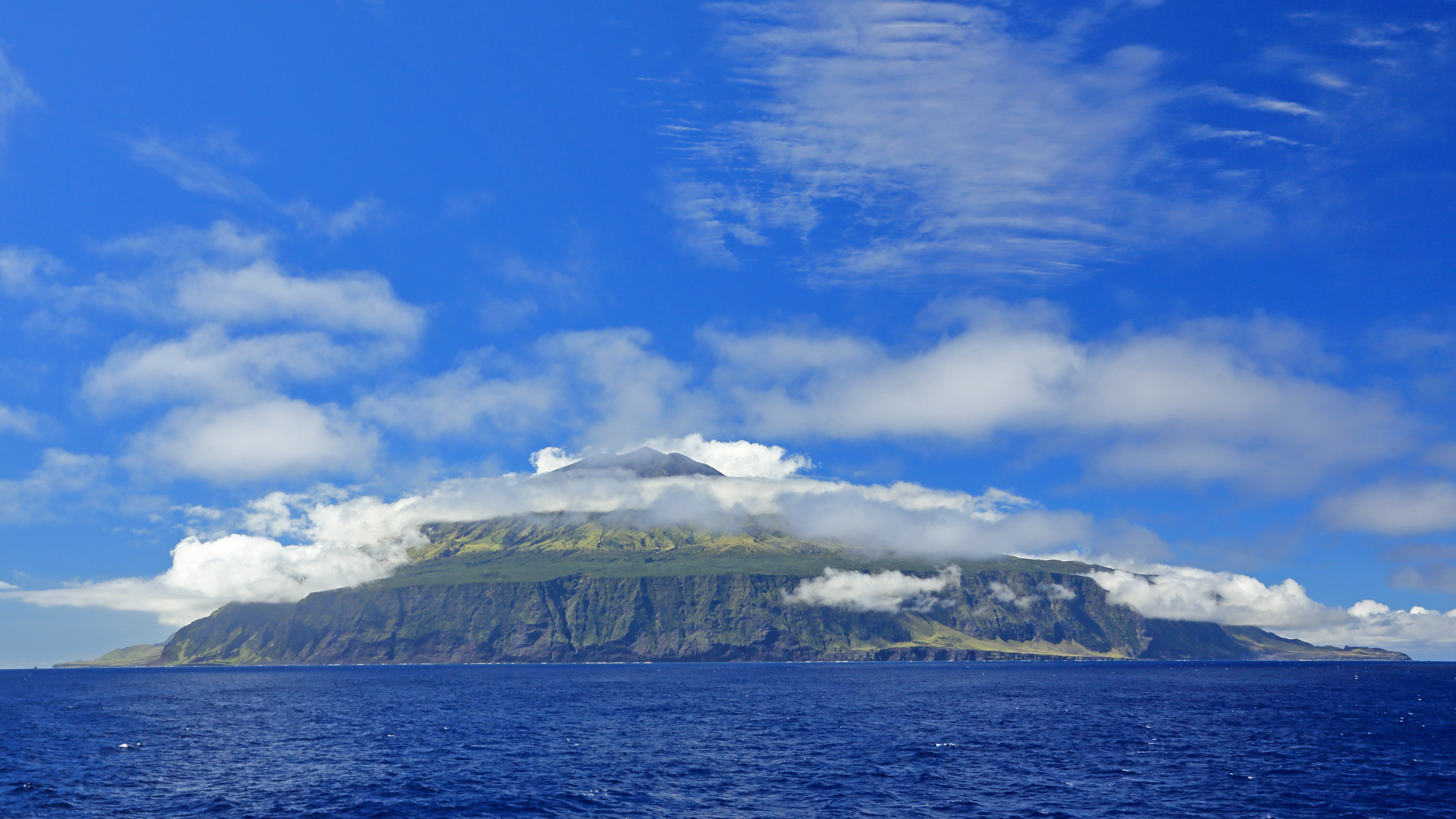 A view of an island from the ocean.